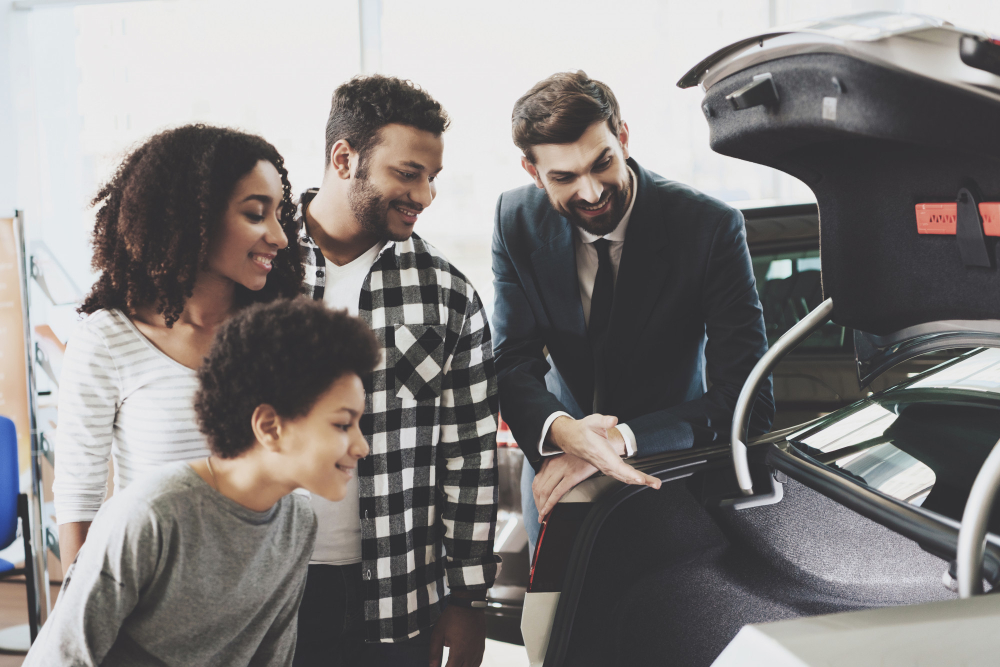 A Woman Buying a Car with Her Family