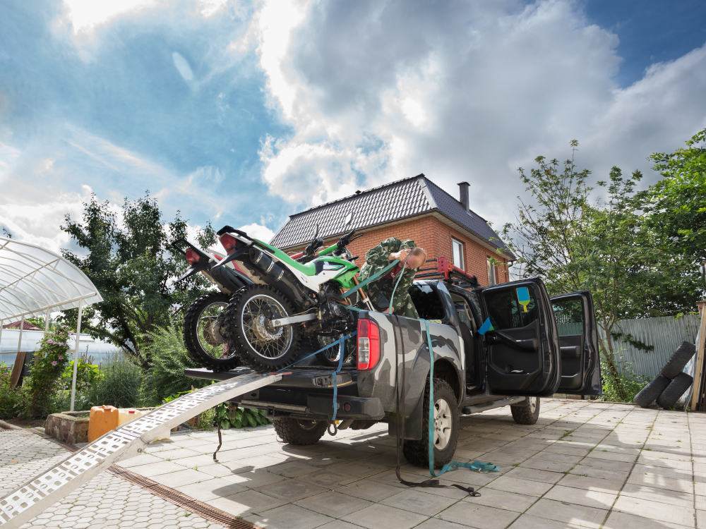 A Car Towing Motorbike