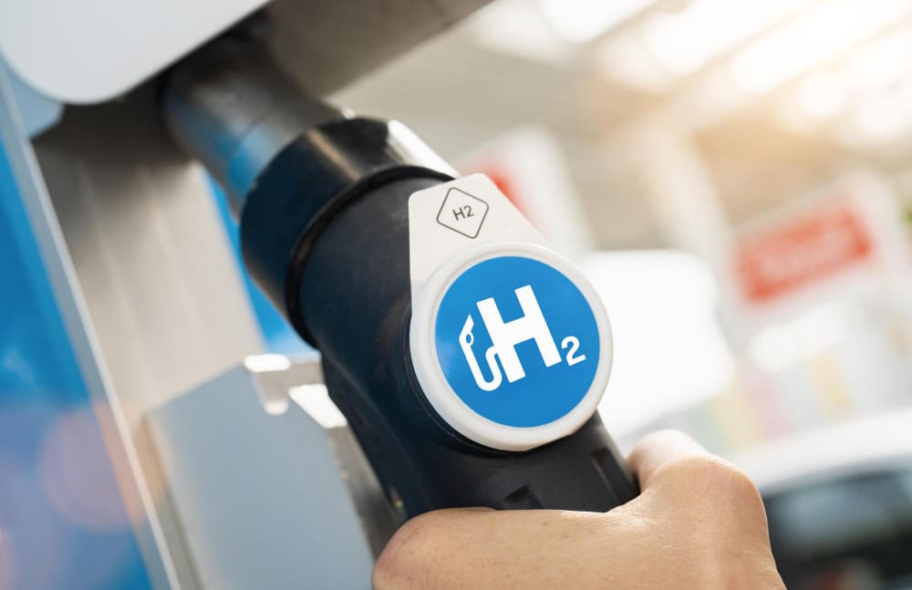 A man hold hydrogen fuel dispenser